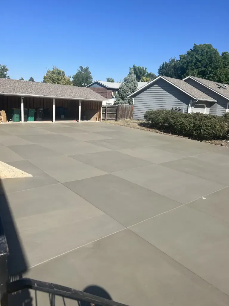 Freshly installed concrete driveway in Windsor, CO, with a smooth and durable finish