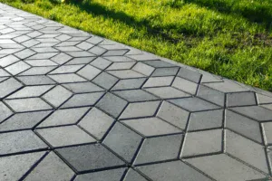 Stamped and colored concrete sidewalk installed by Hugo’s Concrete at a residential property in Northern Colorado.