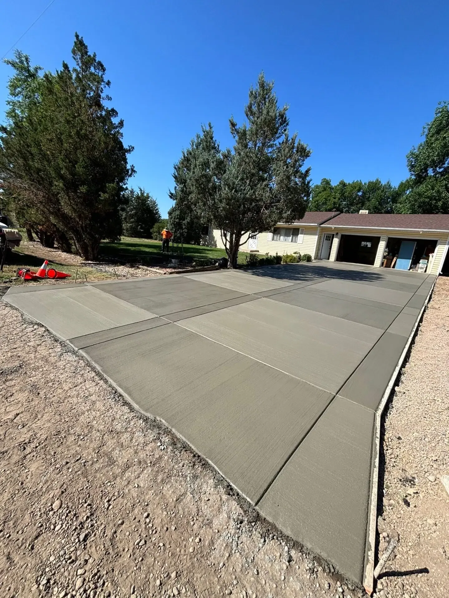Large new broom finished concrete driveway installed by Hugo’s Concrete in Fort Collins