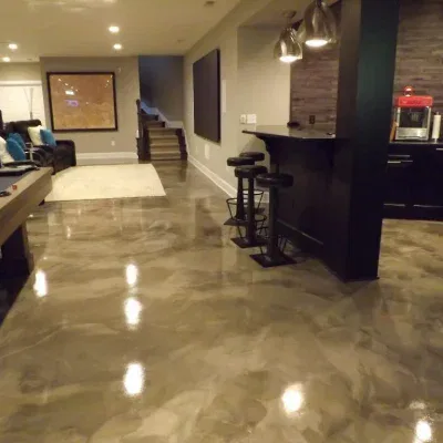 epoxy garage floors Stunning metallic epoxy basement floor installation in Fort Collins by Hugo's Concrete, featuring reflective bronze and copper tones with durable high-gloss finish