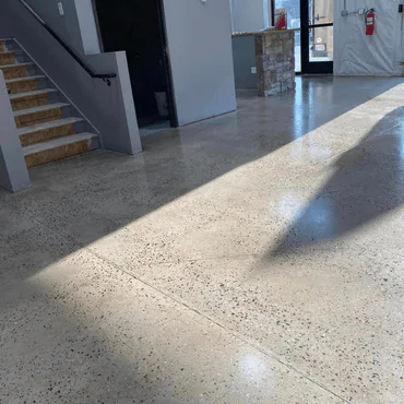 Polished concrete floor in a Northern Colorado commercial office, featuring a sleek and professional finish.
