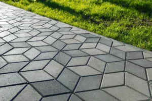 Stamped and colored concrete sidewalk installed by Hugo’s Concrete at a residential property in Northern Colorado.
