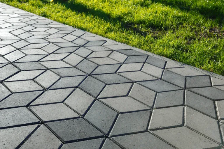 Stamped and colored concrete sidewalk installed by Hugo’s Concrete at a residential property in Northern Colorado.