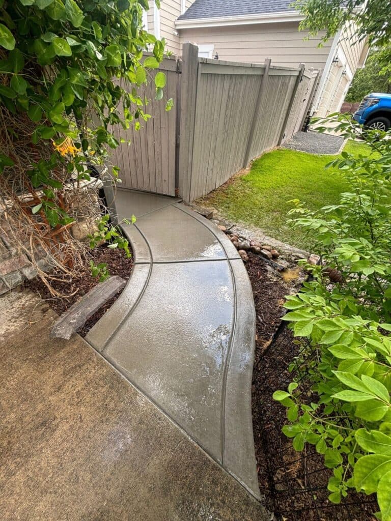 New concrete sidewalk installed on Aruba Dr in Fort Collins, Colorado, featuring clean lines and a smooth finish