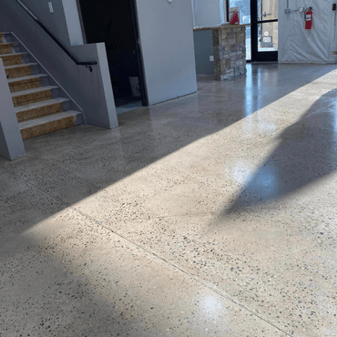 Polished concrete floor in a Northern Colorado commercial office, featuring a sleek and professional finish.