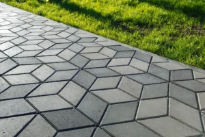 Stamped and colored concrete sidewalk installed by Hugo’s Concrete at a residential property in Northern Colorado.