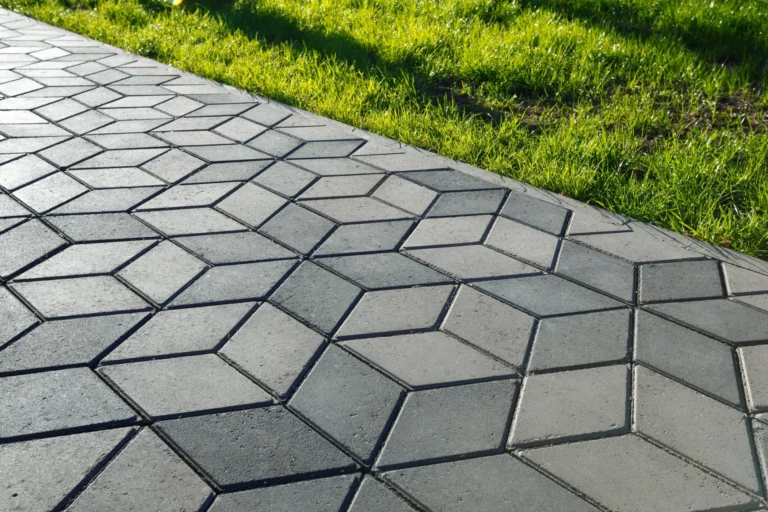 Stamped and colored concrete sidewalk installed by Hugo’s Concrete at a residential property in Northern Colorado.