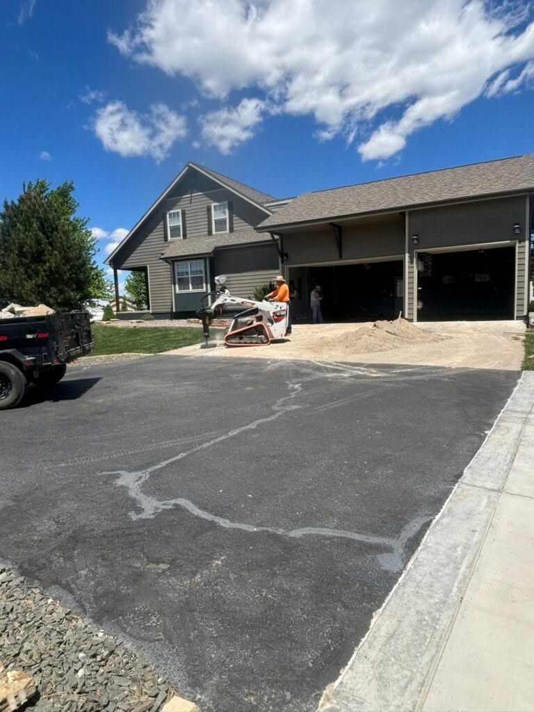 “Old driveway with steel mesh before replacement in Berthoud, CO”