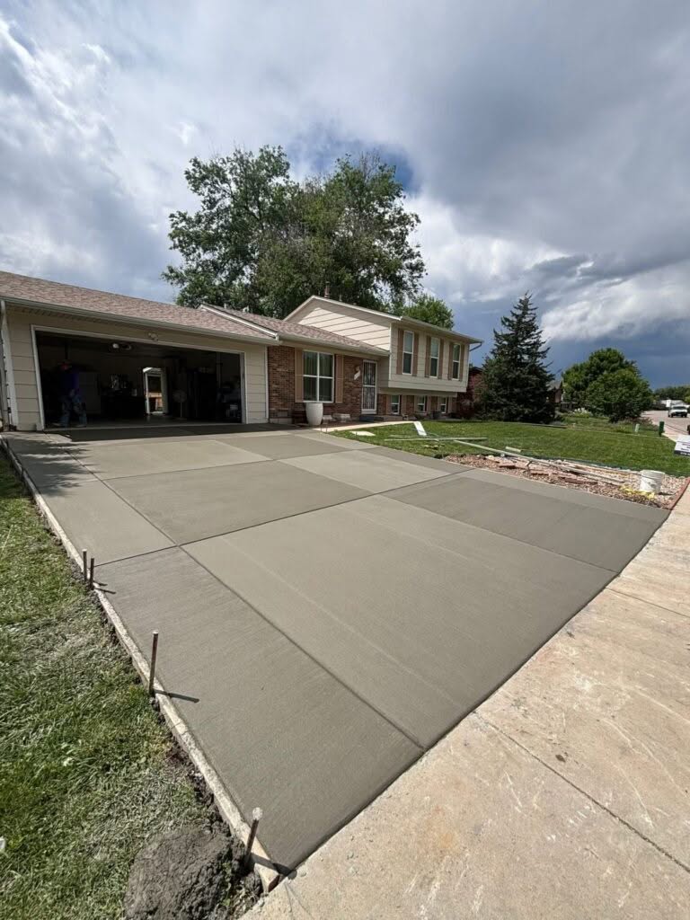 New concrete driveway replacement completed on Wawbler Dr in Fort Collins, Colorado, featuring clean edges and a smooth finish