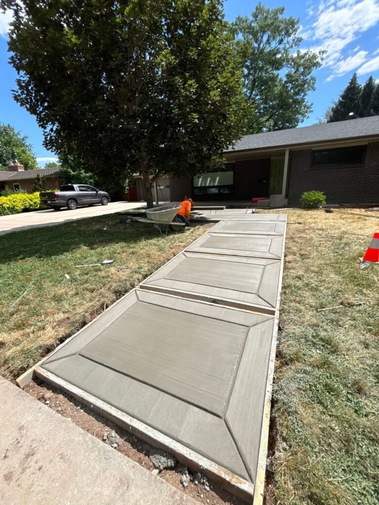New concrete walkway installed along the side of a home on Osage St in Fort Collins, Colorado
