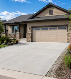 Standard concrete driveway leading to a two-car garage at a Loveland, CO home.