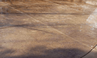 Stamped concrete patio showcasing modern design trends in Colorado, featuring a durable and stylish surface with earthy tones.